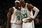 BOSTON - MAY 17:  Rajon Rondo #9 and Ray Allen #20 of the Boston Celtics talk as the Orlando Magic shoot a free throw in Game Seven of the Eastern Conference Semifinals during the 2009 NBA Playoffs at TD Banknorth Garden on May 17, 2009 in Boston, Massachusetts. The Orlando Magic defeated the Boston Celtics 101-82 to advance to the Eastern Conference Finals. NOTE TO USER: User expressly acknowledges and agrees that, by downloading and or using this photograph, User is consenting to the terms and conditions of the Getty Images License Agreement.  (Photo by Elsa/Getty Images)