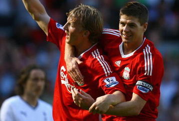 LIVERPOOL, ENGLAND - MAY 24:  Dirk Kuyt of Liverpool celebrates with Steven Gerrard after his deflected shot went in for the second goal during the Barclays  Premier League match between Liverpool and Tottenham Hotspur at Anfield on May 24, 2009 in Liverpool, England.  (Photo by Alex Livesey/Getty Images)