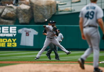 ANAHEIM, CA - MAY 31:  Yuniesky Betancourt #7 of the Seattle Mariners throws to first base against the Los Angeles Angels of Anaheim at Angel Stadium on May 31, 2009 in Anaheim, California.  (Photo by Jeff Gross/Getty Images)