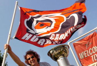 RALEIGH, NC - JUNE 19: Carolina Hurricanes fan Douglas S. Stager from Raleigh waves his team flag outside of RBC Center before the start of game seven of the 2006 NHL Stanley Cup Finals on June 19, 2006 at the RBC Center in Raleigh, North Carolina.  (Photo by Grant Halverson/Getty Images)