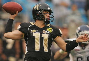 CHARLOTTE, NC - DECEMBER 29:  Riley Skinner #11 of the Wake Forest Demon Deacons throws a pass against the Connecticut Huskies during their game at Bank of America Stadium on December 29, 2007 in Charlotte, North Carolina. (Photo by Streeter Lecka/Getty Images)