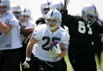 ALAMEDA, CA - MAY 08:  Justin Fargas #25 of the Oakland Raiders runs with the ball during the Raiders minicamp at the team's permanent training facility on May 8, 2009 in Alameda, California.  (Photo by Ezra Shaw/Getty Images)