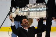 DETROIT - JUNE 12: Co-Ownter and Chairman Mario Lemieux of the Pittsburgh Penguins hoists the Stanley Cup overhead after Game Seven of the 2009 NHL Stanley Cup Finals against the Detroit Red Wings at Joe Louis Arena on June 12, 2009 in Detroit, Michigan. The Penguins defeated the Red Wings 2-1 in the seventh game to win the Stanley Cup Finals series 4 games to 3. (Photo by Harry How/Getty Images)