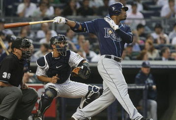 NEW YORK - JUNE 08:  Carl Crawford #13 of the Tampa Bay Rays at bat against the New York Yankees on June 8, 2009 at Yankee Stadium in the Bronx borough of New York City.  (Photo by Nick Laham/Getty Images)