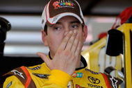 JOLIET, IL - JULY 09:  Kyle Busch, driver of the #18 M&M's Toyota, stands in the garage during practice for the NASCAR Sprint Cup Series LifeLock.com 400 at Chicagoland Speedway on July 9, 2009 in Joliet, Illinois.  (Photo by Rusty Jarrett/Getty Images for NASCAR)