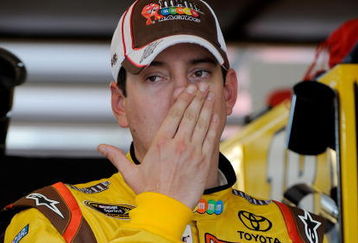 JOLIET, IL - JULY 09:  Kyle Busch, driver of the #18 M&M's Toyota, stands in the garage during practice for the NASCAR Sprint Cup Series LifeLock.com 400 at Chicagoland Speedway on July 9, 2009 in Joliet, Illinois.  (Photo by Rusty Jarrett/Getty Images for NASCAR)