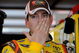 JOLIET, IL - JULY 09:  Kyle Busch, driver of the #18 M&M's Toyota, stands in the garage during practice for the NASCAR Sprint Cup Series LifeLock.com 400 at Chicagoland Speedway on July 9, 2009 in Joliet, Illinois.  (Photo by Rusty Jarrett/Getty Images for NASCAR)