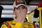 JOLIET, IL - JULY 09:  Kyle Busch, driver of the #18 M&M's Toyota, stands in the garage during practice for the NASCAR Sprint Cup Series LifeLock.com 400 at Chicagoland Speedway on July 9, 2009 in Joliet, Illinois.  (Photo by Rusty Jarrett/Getty Images for NASCAR)