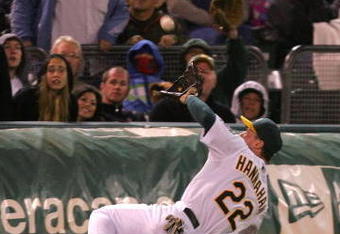 OAKLAND, CA - MAY 23:  Jack Hannahan #22 of the Oakland Athletics makes a diving catch on a ball hit by Miguel Montero #26 of the Arizona Diamondbacks in the eighth inning of their game at the Oakland Coliseum on May 23, 2009 in Oakland, California.  (Photo by Ezra Shaw/Getty Images)