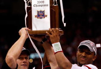 NEW ORLEANS - JANUARY 02:  Head coach Kyle Whittingham and quarterback Brian Johnson #3 of the Utah Utes celebrates after defeating the Alabama Crimson Tide 31-17 during the 75th Allstate Sugar Bowl at the Louisiana Superdome on January 2, 2009 in New Orleans, Louisiana.  (Photo by Chris Graythen/Getty Images)