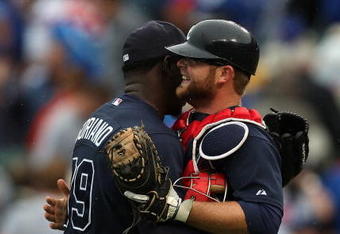 CHICAGO - JULY 08: Rafael Soriano #39 of the Atlanta Braves gets a hug from catcher Brian McCann after finshing off the Chicago Cubs in the 9th inning on July 8, 2009 at Wrigley Field in Chicago, Illinois. The Braves defeated the Cubs 4-1.  (Photo by Jonathan Daniel/Getty Images)