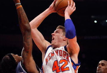 NEW YORK - MARCH 07:  David Lee #42 of the New York Knicks shoots the ball over Gerald Wallace #3 of the Charlotte Bobcats on March 7, 2009 at Madison Square Garden in New York City. NOTE TO USER: User expressly acknowledges and agrees that, by downloading and or using this photograph, User is consenting to the terms and conditions of the Getty Images License Agreement.  (Photo by Nick Laham/Getty Images)
