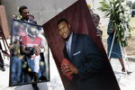 HATTIESBURG, MS - JULY 11:   Portraits of former NFL quarterback Steve McNair are carried away from his funeral service on the campus of the University of Southern Mississippi on July 11, 2009 in Hattiesburg, Mississippi.  (Photo by Dave Martin/Getty Images)