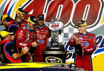 JOLIET, IL - JULY 11:  Mark Martin (R), driver of the #5 CARQUEST/Kellogg's Chevrolet, celebrates in Victory Lane with team members after winning the NASCAR Sprint Cup Series LifeLock.com 400 at Chicagoland Speedway on July 11, 2009 in Joliet, Illinois.  (Photo by Jason Smith/Getty Images for NASCAR)