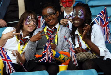 BIRMINGHAM, ENGLAND - JULY 10: Athletics fans enjoy the atmosphere during the 100M womens 1st Round Heats at Alexander Stadium on July 10, 2009 in Birmingham, England.  (Photo by John Gichigi/Getty Images)