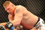 LAS VEGAS - JULY 11:  Brock Lesnar holds down Frank Mir during their heavyweight title bout during UFC 100 on July 11, 2009 in Las Vegas, Nevada. Lesnar defeated Mir by a second round knockout.  (Photo by Jon Kopaloff/Getty Images)