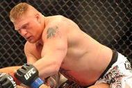 LAS VEGAS - JULY 11:  Brock Lesnar holds down Frank Mir during their heavyweight title bout during UFC 100 on July 11, 2009 in Las Vegas, Nevada. Lesnar defeated Mir by a second round knockout.  (Photo by Jon Kopaloff/Getty Images)