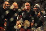 LAS VEGAS - JULY 11:  (2nd R) Georges St. Pierre celebrates his victory against Thiago Alves during their welterweight title bout during UFC 100 on July 11, 2009 in Las Vegas, Nevada. St. Pierre defeated Alves by unanimous decision.  (Photo by Jon Kopaloff/Getty Images)