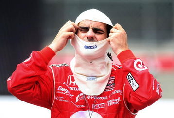 TORONTO, ON - JULY 11:  Dario Franchitti, driver of the #10 Target Chip Ganassi Racing Dallara Honda puts on his fire mask during qualifying for the Indycar Series Honda Indy Toronto on July 11, 2009 in Toronto, Canada.  (Photo by Nick Laham/Getty Images)