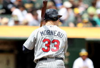 OAKLAND, CA - JUNE 11:  Justin Morneau #33 of the Minnesota Twins bats against the Oakland Athletics during a Major League Baseball game on June 11, 2009 at the Oakland Coliseum in Oakland, California.  (Photo by Jed Jacobsohn/Getty Images)