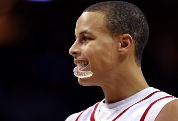 CHARLOTTE, NC - DECEMBER 06:  Stephen Curry #30 of the Davidson Wildcats reacts to his team's 72-67 victory over the North Carolina State Wolfpack during their game at Time Warner Cable Arena on December 6, 2008 in Charlotte, North Carolina.  (Photo by Streeter Lecka/Getty Images)