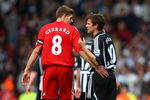LIVERPOOL, UNITED KINGDOM - MAY 03:   Michael Owen of Newcastle United chats with Steven Gerrard of Liverpool at the end of the Barclays Premier League match between Liverpool and Newcastle United at Anfield on May 3, 2009 in Liverpool, England. (Photo by Clive Brunskill/Getty Images)