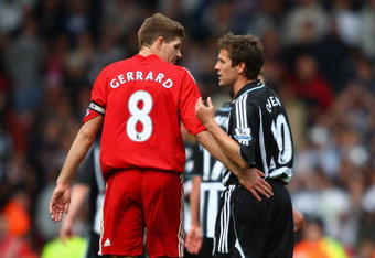 LIVERPOOL, UNITED KINGDOM - MAY 03:   Michael Owen of Newcastle United chats with Steven Gerrard of Liverpool at the end of the Barclays Premier League match between Liverpool and Newcastle United at Anfield on May 3, 2009 in Liverpool, England. (Photo by Clive Brunskill/Getty Images)