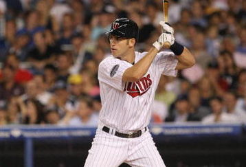 NEW YORK - JULY 15:  Joe Mauer #7 of the American League All-Stars at bat against the National League All-Stars during the 79th MLB All-Star Game at Yankee Stadium on July 15, 2008 in New York, New York. (Photo by Nick Laham/Getty Images)