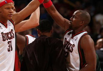 MILWAUKEE - FEBRUARY 26: Michael Redd #22 of the Milwaukee Bucks (R) is congratulated by teammates including Charlie Villanueva #31 after hitting the game-winning three-point shot against the Cleveland Cavaliers on February 26, 2008 at the Bradley Center in Milwaukee, Wisconsin. The Bucks defeated the Cavaliers 105-102. NOTE TO USER: User expressly acknowledges and agreees that, by downloading and/or using this Photograph, User is consenting to the terms and conditions of the Getty Images License Agreement. (Photo by Jonathan Daniel/Getty Images)