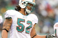 PHILADELPHIA - NOVEMBER 18:  Channing Crowder #52 of the Miami Dolphins looks on during the NFL game against the Philadelphia Eagles at Lincoln Financial Field on November 18, 2007 in Philadelphia, Pennsylvania. (Photo by Al Bello/Getty Images)