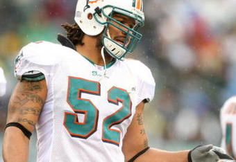 PHILADELPHIA - NOVEMBER 18:  Channing Crowder #52 of the Miami Dolphins looks on during the NFL game against the Philadelphia Eagles at Lincoln Financial Field on November 18, 2007 in Philadelphia, Pennsylvania. (Photo by Al Bello/Getty Images)