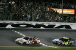 DAYTONA BEACH, FL - JULY 04: Tony Stewart, driver of the #14 Burger King Chevrolet, crosses the finish line ahead of Jimmie Johnson, drive of the #48 Lowe's Kobalt Tools Chevrolet, to win the NASCAR Sprint Cup Series 51st Annual Coke Zero 400 at Daytona International Speedway on July 4, 2009 in Daytona Beach, Florida.  (Photo by Jerry Markland/Getty Images for NASCAR)