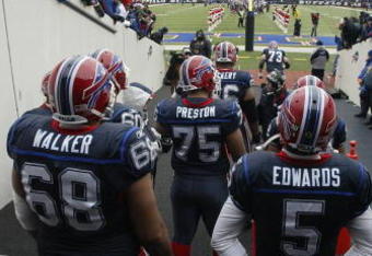 ORCHARD PARK, NY - DECEMBER 28:  Langston Walker #68, Duke Preston #75 and Trent Edwards #5 of the Buffalo Bills wait to walk on the field before the game against the New England Patriots on December 28, 2008 at Ralph Wilson Stadium in Orchard Park, New York. (Photo by Rick Stewart/Getty Images)