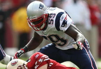 SAN FRANCISCO - OCTOBER 05: Gary Guyton #59 of the New England Patriots tackles quarterback J.T. O'Sullivan #14 of the San Francisco 49ers during an NFL game on October 5, 2008 at Candlestick Park in San Francisco, California.  (Photo by Jed Jacobsohn/Getty Images)
