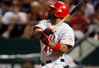 ARLINGTON, TX - JULY 1:  Torii Hunter #48 of the Los Angeles Angels of Anaheim hits a two-run double against the Texas Rangers in the seventh inning at Rangers Ballpark July 1, 2009 in Arlington, Texas.  (Photo by Ronald Martinez/Getty Images)