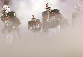 MIAMI - NOVEMBER 13:  Ramon Buchanan #45, Eric Houston #46 and Ian Symonette #68 of the Miami Hurricanes run out of the tunnel during introductions prior to taking on the Virginia Tech Hokies at Dolphin Stadium on November 13, 2008 in Miami, Florida.  (Photo by Doug Benc/Getty Images)