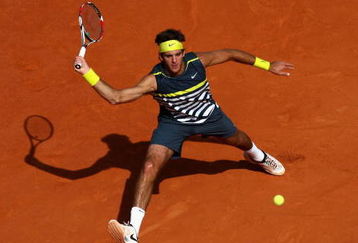 PARIS - JUNE 05:  Juan Martin Del Potro of Argentina stretches to hit a forehand during the Men's Singles Semi Final match against Roger Federer of Switzerland on day thirteen of the French Open at Roland Garros on June 5, 2009 in Paris, France.  (Photo by Ryan Pierse/Getty Images)
