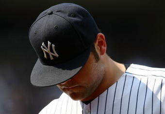 NEW YORK - JUNE 07:  Joba Chamberlain #62 of the New York Yankeeswalks from the field against the Tampa Bay Rays during their game on June 7, 2009 at Yankee Stadium in the Bronx borough of New York City.  (Photo by Chris McGrath/Getty Images)