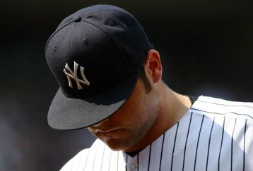 NEW YORK - JUNE 07:  Joba Chamberlain #62 of the New York Yankeeswalks from the field against the Tampa Bay Rays during their game on June 7, 2009 at Yankee Stadium in the Bronx borough of New York City.  (Photo by Chris McGrath/Getty Images)