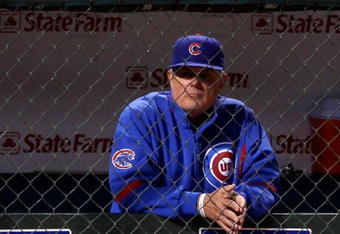 CHICAGO - OCTOBER 02:  Manager Lou Piniella #41 of the Chicago Cubs looks on from the dugout against the Los Angeles Dodgers in Game Two of the NLDS during the 2008 MLB Playoffs at Wrigley Field on October 2, 2008 in Chicago, Illinois.  (Photo by Jamie Squire/Getty Images)