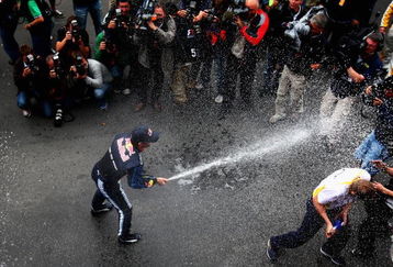 NURBURG, GERMANY - JULY 12:  Mark Webber of Australia and Red Bull Racing celebrates with team mates in the paddock after winning the German Formula One Grand Prix at Nurburgring on July 12, 2009 in Nurburg, Germany.  (Photo by Clive Mason/Getty Images)
