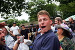 ELMONT, NEW YORK - JUNE 5:  A fan gets a little drunk after drinking beer funnels before the running of the races on June 5, 2004 at the 136th Belmont Stakes in Elmont, New York.  (Photo by Ezra Shaw/Getty Images)