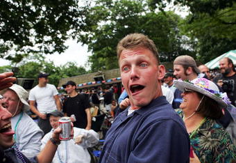 ELMONT, NEW YORK - JUNE 5:  A fan gets a little drunk after drinking beer funnels before the running of the races on June 5, 2004 at the 136th Belmont Stakes in Elmont, New York.  (Photo by Ezra Shaw/Getty Images)