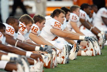 LUBBOCK,TEXAS - NOVEMBER 1:  Colt McCoy #12 of the Texas Longhorns stretches before the game against the Texas Tech Red Raiders on November 1, 2008 at Jones Stadium in Lubbock, Texas. (Photo by: Jamie Squire/Getty Images)