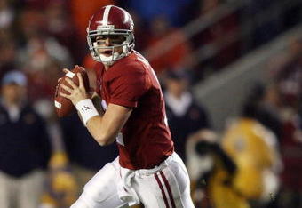 TUSCALOOSA, AL - NOVEMBER 29:  Quarterback Greg McElroy #12 of the Alabama Crimson Tide rolls out to pass against the Auburn Tigers at Bryant-Denny Stadium on November 29, 2008 in Tuscaloosa, Alabama. Alabama defeated Auburn 36-0.  (Photo by Doug Benc/Getty Images)
