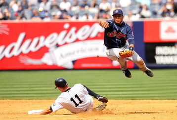 NEW YORK - APRIL 19:  Jhonny Peralta #2 of the Cleveland Indians turns a double play as Brett Gardner #11 of the New York Yankees slides in to second base in the sixth inning at Yankee Stadium on April 19, 2009 in the Bronx borough of New York City.  (Photo by Ezra Shaw/Getty Images)
