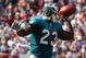 FOXBORO, MA - SEPTEMBER 21: Ronnie Brown #23 of he Miami Dolphins throws a touchdown pass in the third quarter against the New England Patriots at Gillette Stadium on September 21, 2008 in Foxboro, Massachusetts. (Photo by Jim Rogash/Getty Images)
