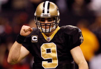 NEW ORLEANS - DECEMBER 28:  Quarterback Drew Brees #9 of the New Orleans Saints pumps his fist during the game against the Carolina Panthers on December 28, 2008 at the Superdome in New Orleans, Louisiana.  (Photo by Chris Graythen/Getty Images)