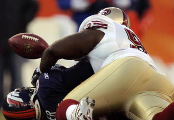 DENVER - DECEMBER 31:  Defensive tackle Anthony Adams #91 of the San Francisco 49ers sacks quarterback Jay Cutler #6 of the Denver Broncos in the second quarter December 31, 2006 at Invesco Field at Mile High in Denver, Colorado.  Cutler was injured on the play.  (Photo by Brian Bahr/Getty Images)  at Invesco Field at Mile High December 31, 2006 in Denver, Colorado. Cutler was injured on the play.  (Photo by Brian Bahr/Getty Images)