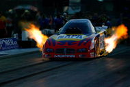 CONCORD, NC - SEPTEMBER 12:  Ron Capps, driver of the NAPA funny car leaves the line during second round qualifying for the NHRA Carolinas Nationals at the Zmax Dragway on September 12, 2008 in Concord, North Carolina.  (Photo by Rusty Jarrett/Getty Images)